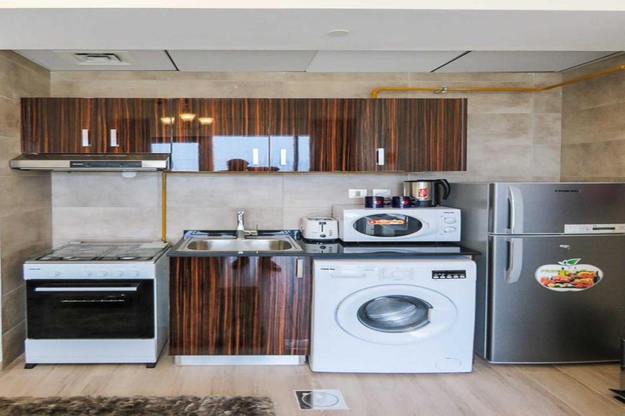 Oyo 860 Studio Apartment, Maya Tower 4, Jumeirah Village Triangle دبي المظهر الخارجي الصورة